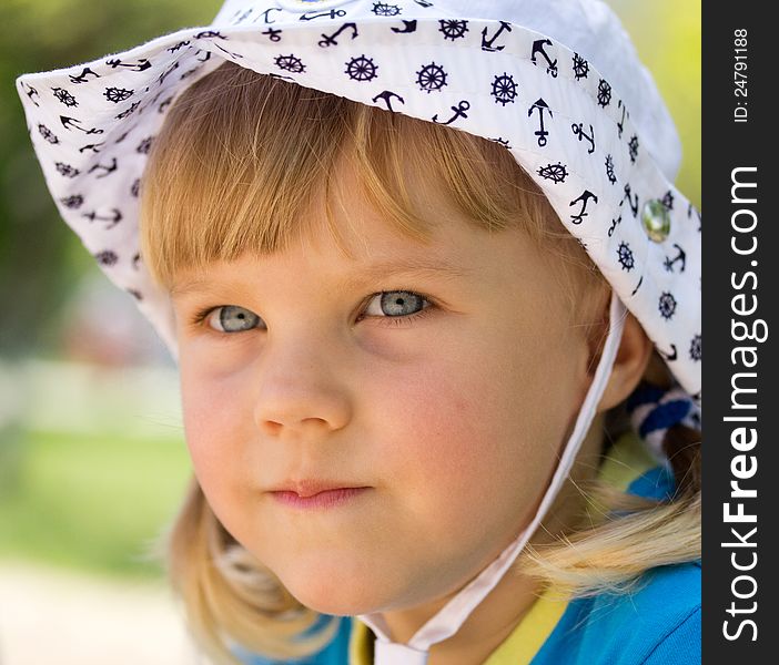 Little girl in a white panama. Little girl in a white panama