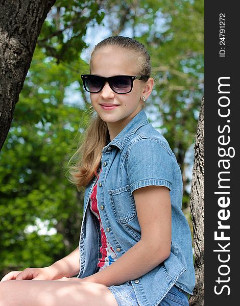Portrait of a young beautiful girl in sunglasses. Portrait of a young beautiful girl in sunglasses