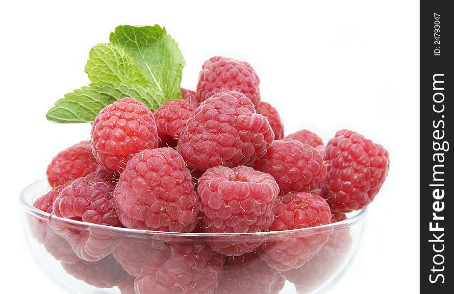 Raspberry on white background in the restaurant. Raspberry on white background in the restaurant