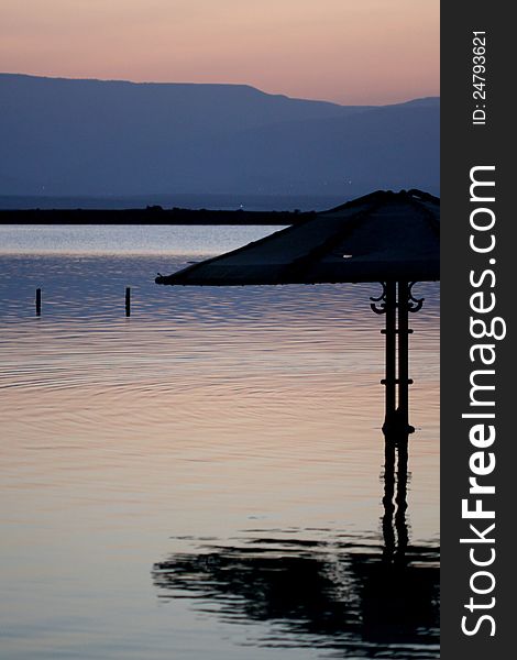 Beach Umbrella At Sunrise Dead Sea Israel