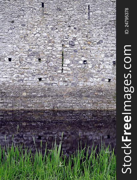 Trim castle wall and moat. The medieval irish kings castle at Trim, County Meath, Ireland. Spring season, early morning.