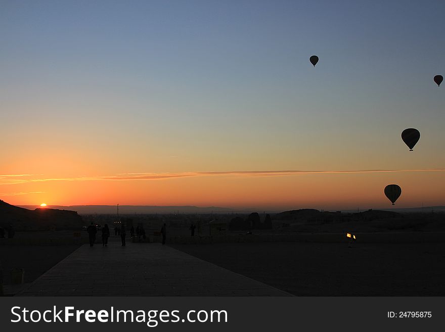 Balloons lift off at dawn, over the valley of the Queens, Eqypt. Balloons lift off at dawn, over the valley of the Queens, Eqypt