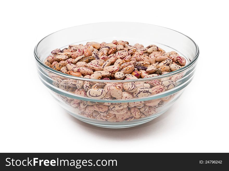 Pink haricot beans in a bowl on white background