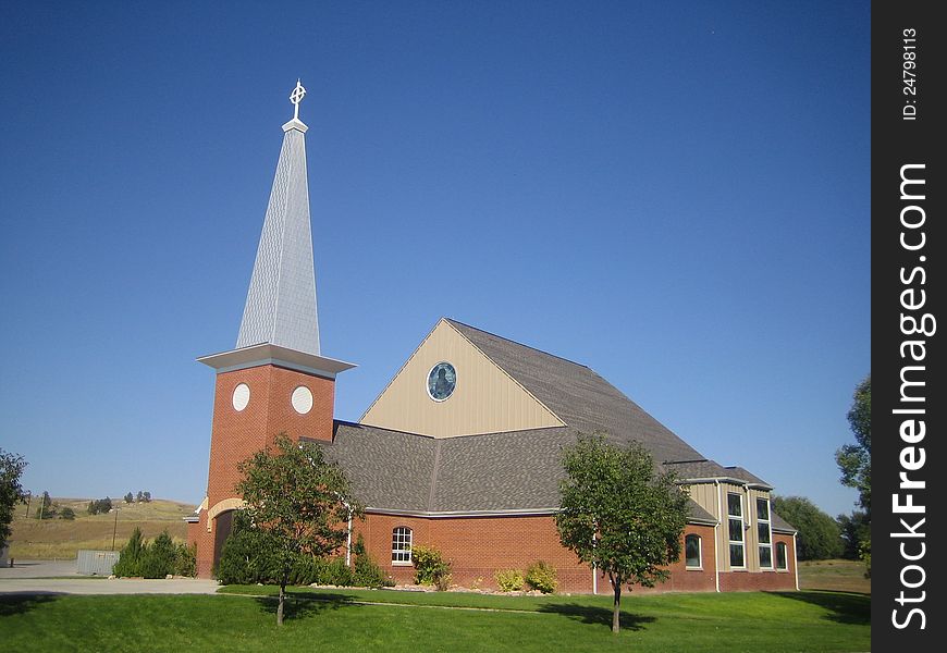 This is a picture of the New Holy Rosary church, Pine Ridge, South Dakota, home of the Ogallala Sioux Indian.

Symbols and materials important to the Native American culture were integrated as much as possible into the design of such things as the main altar, tabernacle, and stained glass windows.