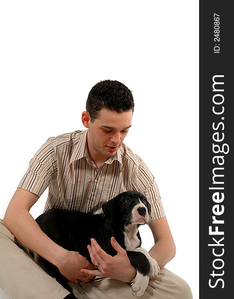 Young man is holding and looking at his sweet dog. Young man is holding and looking at his sweet dog.