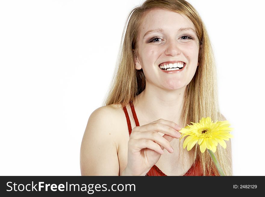 Attractive blond picking petals from a daisy. Attractive blond picking petals from a daisy