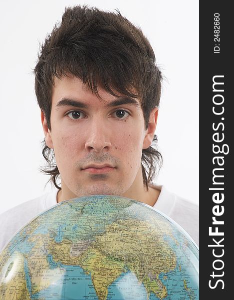 One young man with a white shirt is holding a globe. One young man with a white shirt is holding a globe