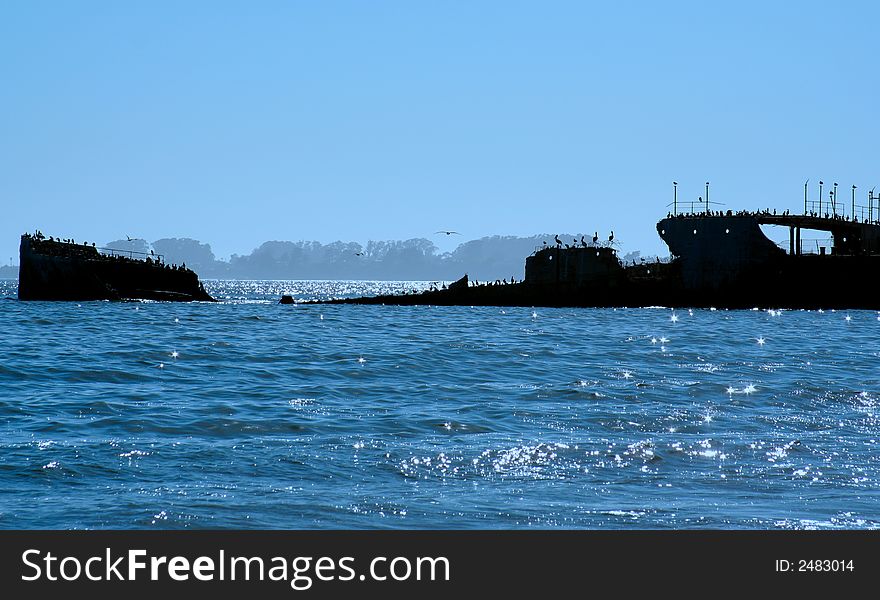 Submerged ship in silhouette at twilight. Submerged ship in silhouette at twilight