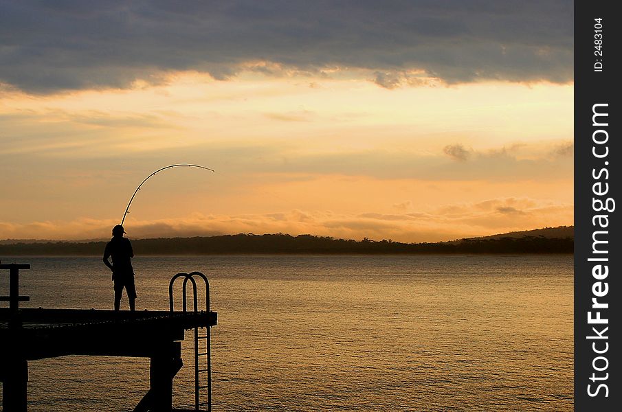 Fisherman on the Merimbula Wharf