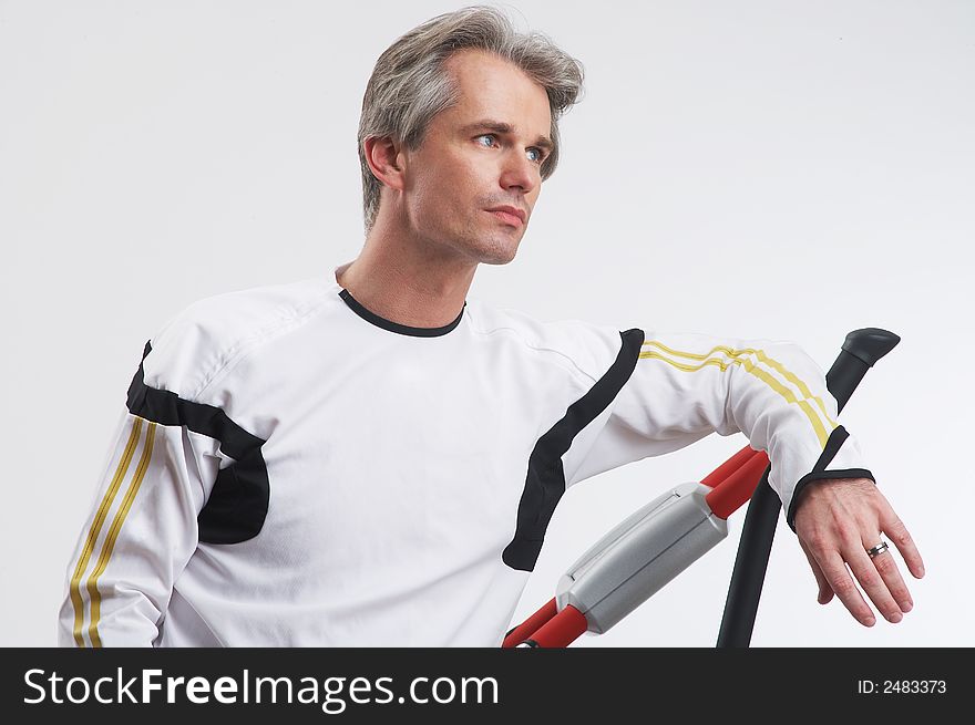 Portrait of a handsome man with his exercise equipment. Portrait of a handsome man with his exercise equipment