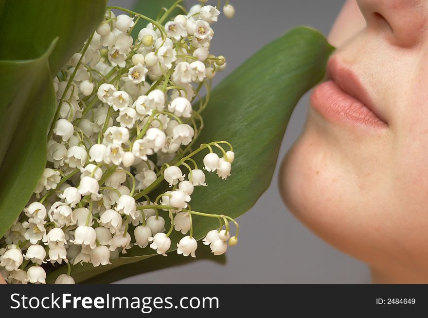 An image of a woman with lily of the vallay