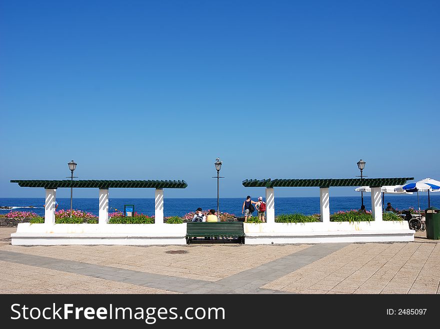 Relaxing at the waterfront of Purto Cruz, Spain