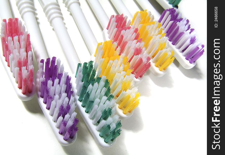 Assorted colors toothbrushes arranged in order