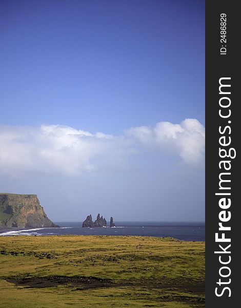 View to the volcanic sea stacks Iceland