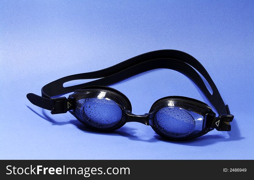 Swimming goggle on blue background. Swimming goggle on blue background