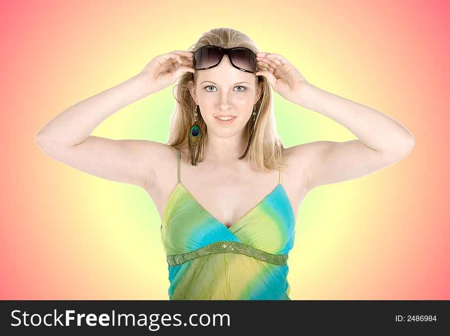 Beautiful young blond woman wearing sun glasses on colorful background. Beautiful young blond woman wearing sun glasses on colorful background