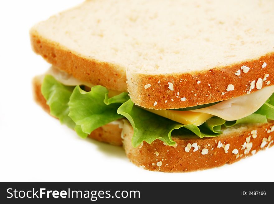 Turkey sandwich on whole wheat on a white background. Turkey sandwich on whole wheat on a white background