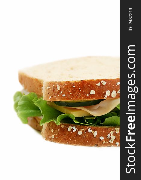 Turkey sandwich on whole wheat on a white background. Turkey sandwich on whole wheat on a white background