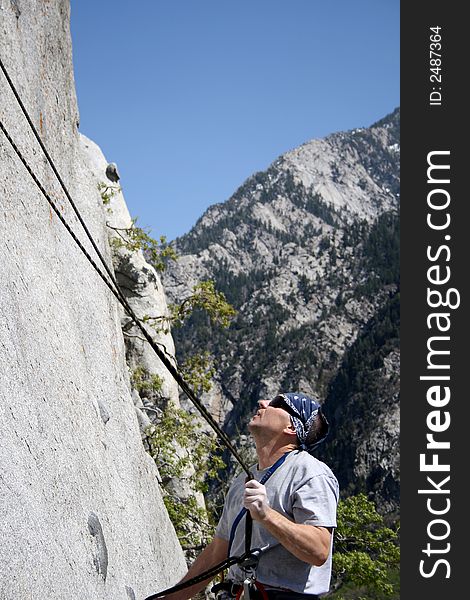 Rock Climber Checks Rope