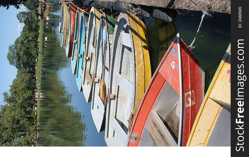 Old rowboats lined up against the dock