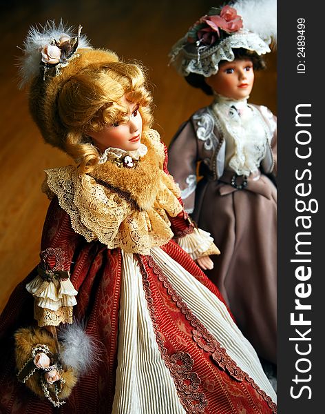 Two elegant lady porcelain dolls. Two elegant lady porcelain dolls