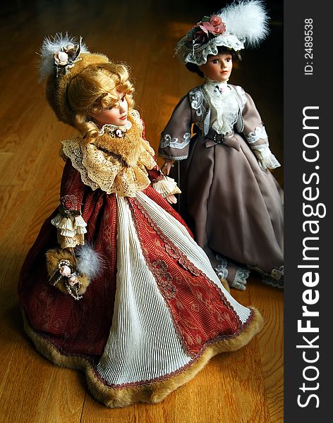 Two elegant lady porcelain dolls. Two elegant lady porcelain dolls