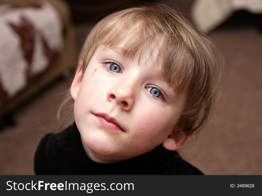 The girl with blue eyes poses at home. The girl with blue eyes poses at home