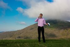 Man With Notepad And Telephone On Mountain Stock Images Man With Notepad And Telephone On Mountain Stock Images