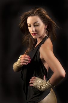 Beautiful Woman In Black And Gold Fashion Royalty Free Stock Photography