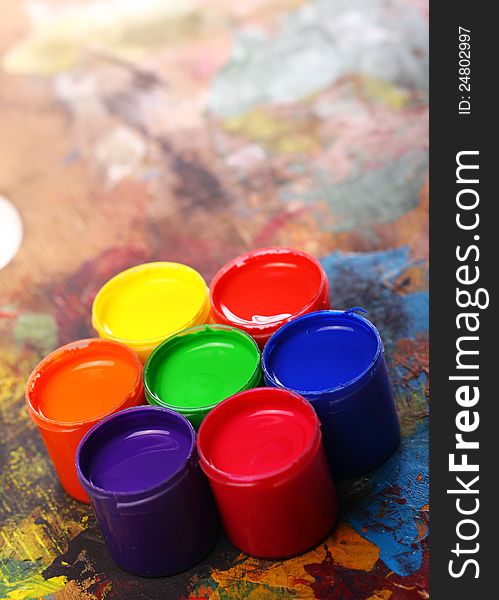 Close up of cans with colorful paint