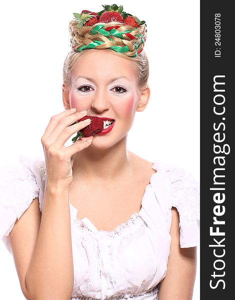 Woman with strawberry in her hairstyle over white background