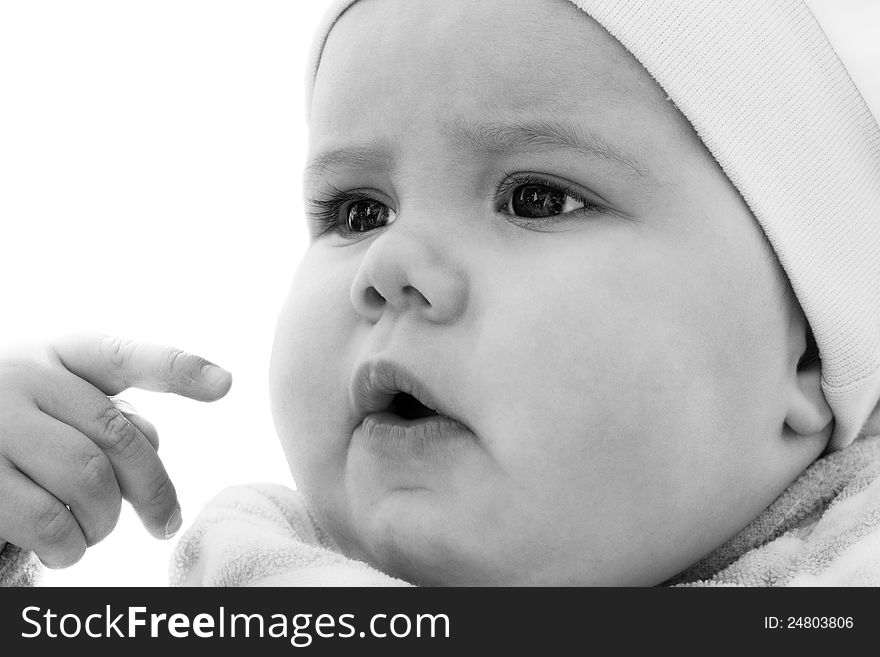 Black and white portrait of a baby girl interested