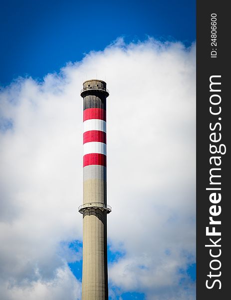 Power plant chimney  with red and white stripes. Power plant chimney  with red and white stripes.