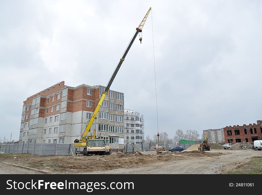 Big Crane on the background of the construction site, at home