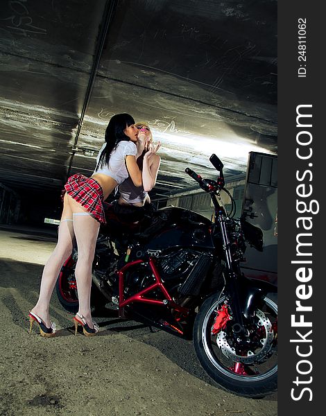 Sexy young girl in a tunnel with the motorcycle. Sexy young girl in a tunnel with the motorcycle