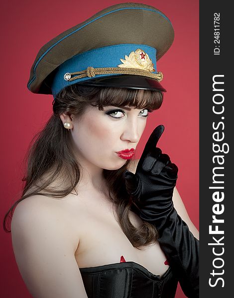 model wearing corset and military hat. model wearing corset and military hat