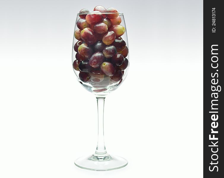 Grapes in a tall wine glass. Grapes in a tall wine glass