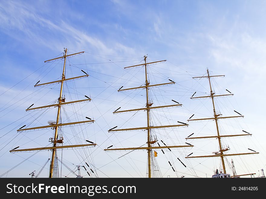 The masts of the yachts against sky.