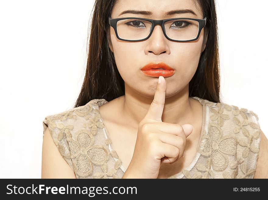 Woman with finger on lips you can feel she please be quiet