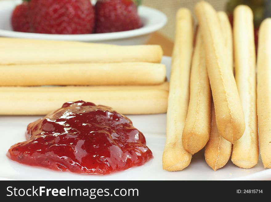 Bread sticks with fresh strawberry jam. Bread sticks with fresh strawberry jam