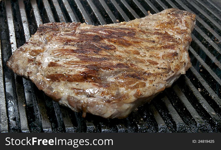 Steaks cooked on a grill in the restaurant