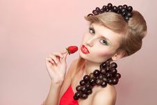 Woman With Strawberry And Bunch Of Grapes Royalty Free Stock Image