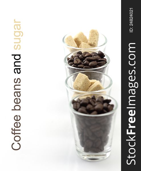 Coffee beans and sugar in glass