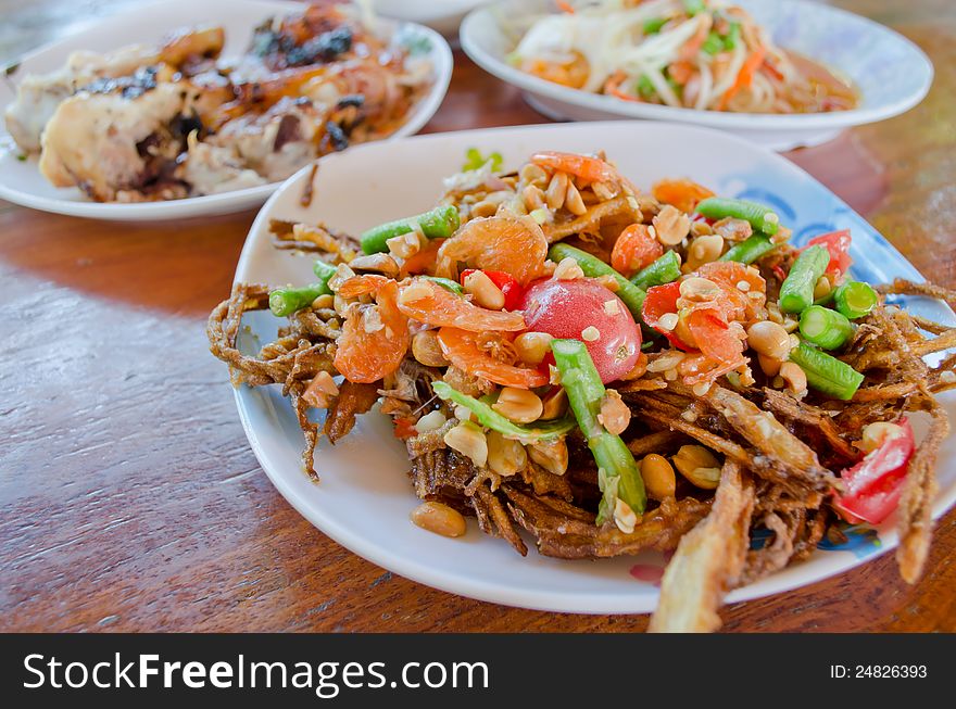 Fried papaya salad on table at restaurant