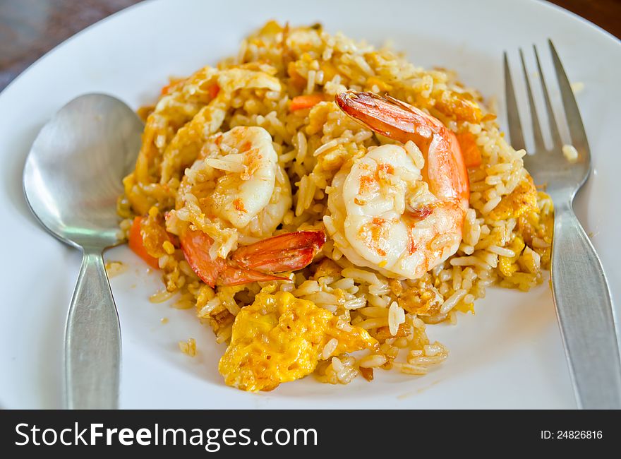 Close up fried rice with shrimp on white dish