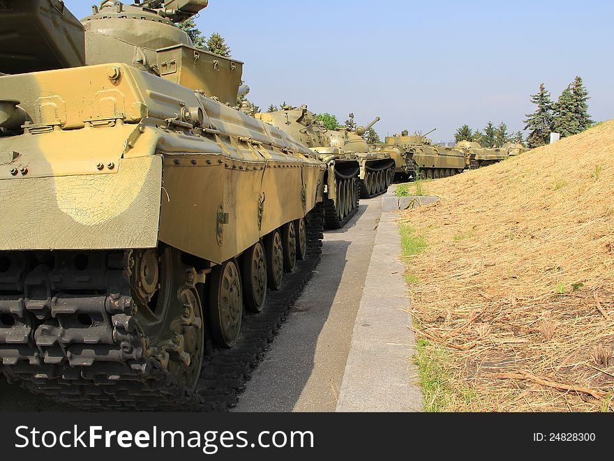 Moving armored  column against  grass background. Moving armored  column against  grass background