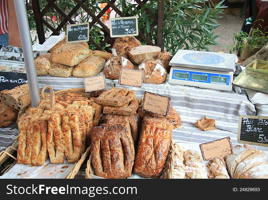 Typical French sorts of bread on a local market in the Provence, France. Typical French sorts of bread on a local market in the Provence, France