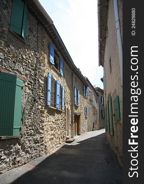 Narrow street in a small village in the Provence, France. Narrow street in a small village in the Provence, France