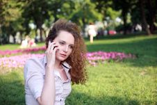Cute Curly Girl Talking On The Phone Stock Photography