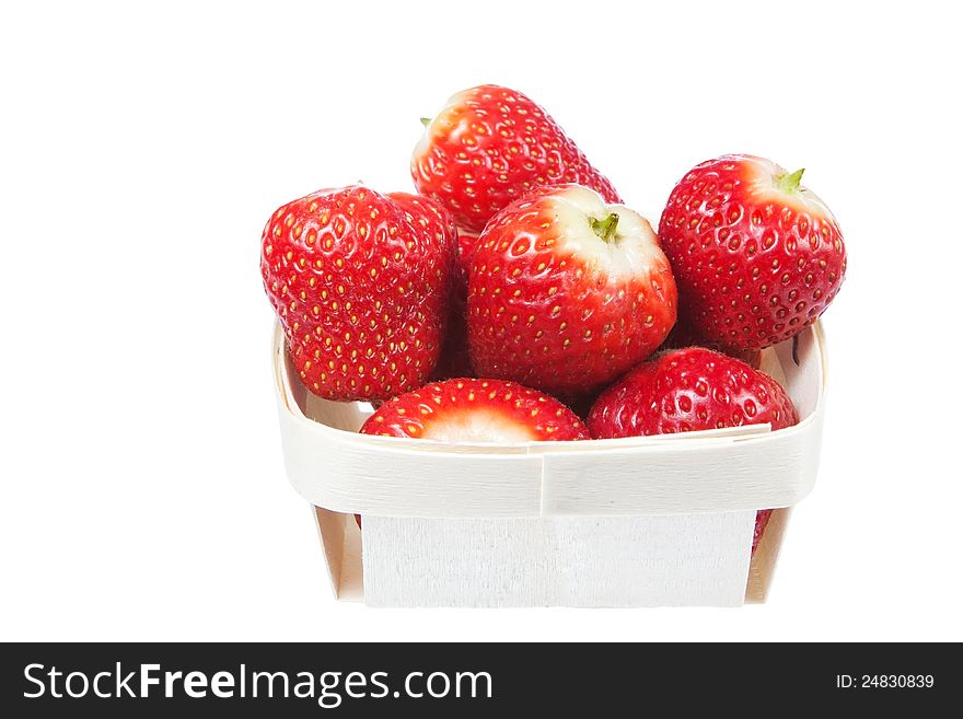 Strawberries in a wooden basket. On a white background. Strawberries in a wooden basket. On a white background.